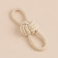 Rope knot toy on a beige background