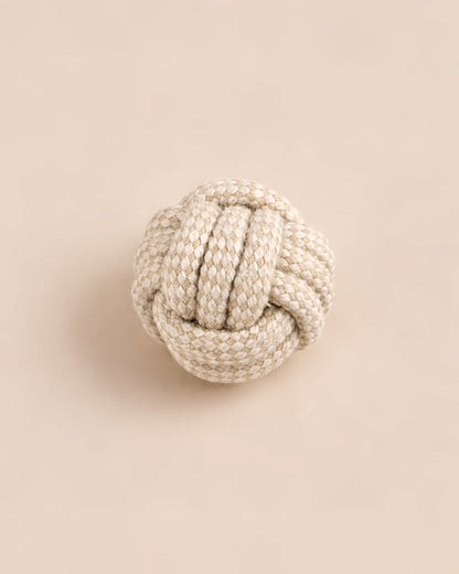 Textured rope knot on a beige background